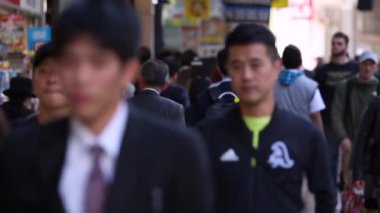 People in Tokyo City. Business District. Rush Hour Time People Are Walking on the Sidewalk. Japanese People. Blurry Background