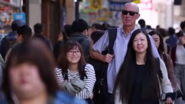 People in Tokyo City. Business District. Rush Hour Time People Are Walking on the Sidewalk. Japanese People. Blurry Background