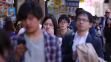 People in Tokyo City. Business District. Rush Hour Time People Are Walking on the Sidewalk. Japanese People. Blurry Background
