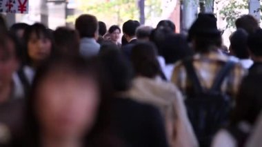 People in Tokyo City. Business District. Rush Hour Time People Are Walking on the Sidewalk. Japanese People. Blurry Background