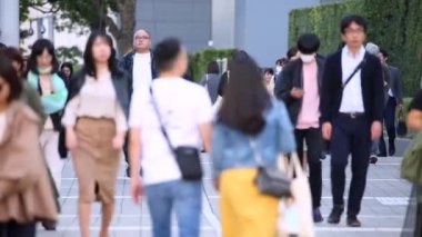 People Walking in Tokyo City. Business District. Rush Hour Time. Japanese People. Shinjuku District in Tokyo. Blurry Background