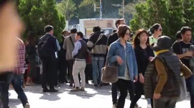 Public Smoking Area in Tokyo, Japan. People Are Smoking Next To Shinjuku Train Station. Sunny Day