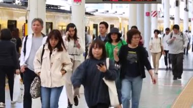 Seibu Metro Train Station Platform in Tokyo. Underground Metro Train Station During Rush Hour. People Leaving Station and Walking on Platform. Seibu Haijima Line. Asian commuters traveling.