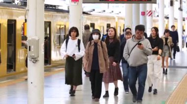 Seibu Metro Train Station Platform in Tokyo. Underground Metro Train Station During Rush Hour. People Leaving Station and Walking on Platform. Seibu Haijima Line. Asian commuters traveling.