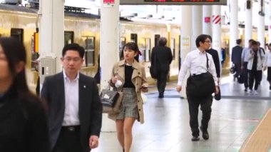 Seibu Metro Train Station Platform in Tokyo. Underground Metro Train Station During Rush Hour. People Leaving Station and Walking on Platform. Seibu Haijima Line. Asian commuters traveling.