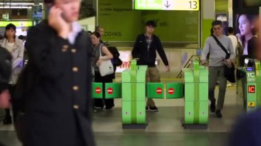 Shinjuku Ticket Gates in Tokyo Metro. Pasmo Card or Suica Card. People Taping Card to go Through the Gate. Tokyo Underground Metro Network