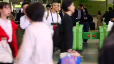 Shinjuku Ticket Gates in Tokyo Metro. Pasmo Card or Suica Card. People Taping Card to go Through the Gate. Tokyo Underground Metro Network