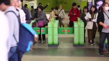 Shinjuku Ticket Gates in Tokyo Metro. Pasmo Card or Suica Card. People Taping Card to go Through the Gate. Tokyo Underground Metro Network