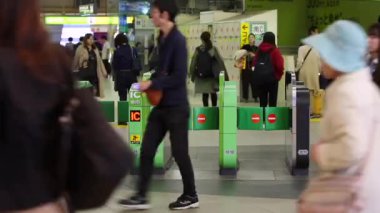 Shinjuku Ticket Gates in Tokyo Metro. Pasmo Card or Suica Card. People Taping Card to go Through the Gate. Tokyo Underground Metro Network