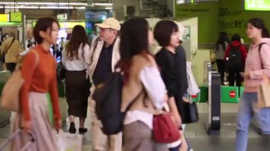 Shinjuku Ticket Gates in Tokyo Metro. Pasmo Card or Suica Card. People Taping Card to go Through the Gate. Tokyo Underground Metro Network