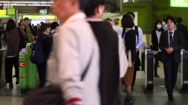 Shinjuku Ticket Gates in Tokyo Metro. Pasmo Card or Suica Card. People Taping Card to go Through the Gate. Tokyo Underground Metro Network