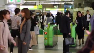 Shinjuku Ticket Gates in Tokyo Metro. Pasmo Card or Suica Card. People Taping Card to go Through the Gate. Tokyo Underground Metro Network