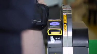 Shinjuku Ticket Gates in Tokyo Metro. Pasmo Card or Suica Card. People Taping Card to go Through the Gate. Tokyo Underground Metro Network