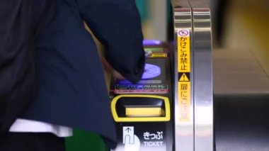Shinjuku Ticket Gates in Tokyo Metro. Pasmo Card or Suica Card. People Taping Card to go Through the Gate. Tokyo Underground Metro Network