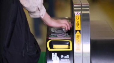 Shinjuku Ticket Gates in Tokyo Metro. Pasmo Card or Suica Card. People Taping Card to go Through the Gate. Tokyo Underground Metro Network