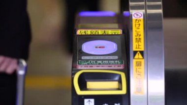 Shinjuku Ticket Gates in Tokyo Metro. Pasmo Card or Suica Card. People Taping Card to go Through the Gate. Tokyo Underground Metro Network