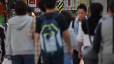 Tokyo Lottery Kiosk and Blurry People Walking in Background
