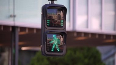 Pedestrian Traffic Light Green Sign and People Are Crossing Street in Tokyo, Japan.