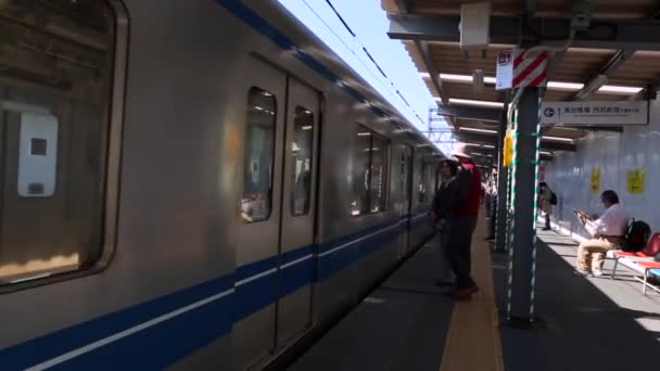 Tokyo Metro Train Approaching People Waiting Ready Travel Seibu Line — Stockvideo