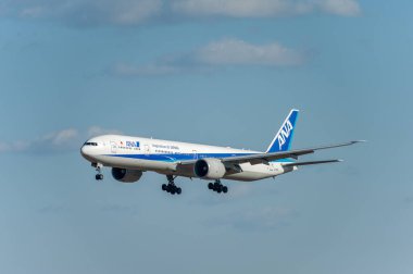 NARITA - JAPAN, JANUARY 25, 2017: JA735A Boeing 777 All Nippon Airways landing in International Narita Airport, Japan.