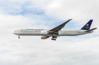 HZ-AK21 Saudi Arabian Airlines Boeing 777 Landing in London Heathrow International Airport. England.