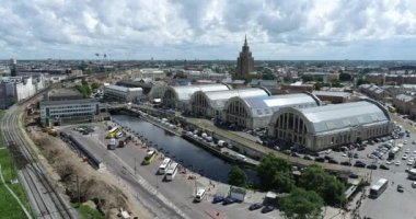Riga Bus Station in Latvia and Market Square in Background. Drone Point of View.