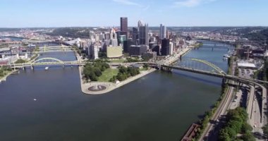Aerial view of Pittsburgh, Pennsylvania. Downtown and Two Rivers in Background. Ferry in Water. Aerial View