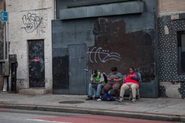 Baltimore, Maryland - October 03, 2019: People Are Sitting on the Bench in Baltimore and Waiting for the Coach. Bus Stop.