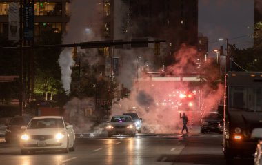 Baltimore, Maryland - October 03, 2019: Night Traffic in Baltimore, Maryland. Vehicles and Fire Department Vehicle with Flashing Lights in Background.
