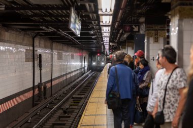Manhattan, NYC - October 06, 2019: Metro Station in Manhattan Full of People. NYC Metro System and People are Waiting for the Train. Rush Hour.