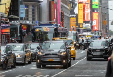 Manhattan, NYC - October 06, 2019: Traffic in Manhattan, NYC. Public Transport, Taxi and Vehicles in Background