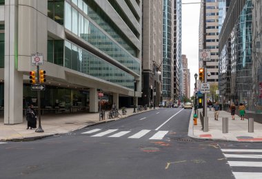 PHILADELPHIA, PENNSYLVANIA - SEPTEMBER 30, 2019: Philadelphia Cityscape ant Street. Empty Intersection with Red Traffic Light Signal. Don't Block The Box Sign