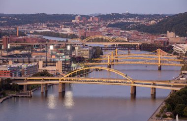 Cityscape of Pittsburgh and Evening Light. Fort Duquesne Bridge in Background.