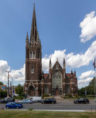 Church Exterior in Pittsburgh, Pennsylvania. Cloudy Blue Sky and Street