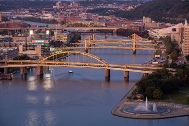 Cityscape of Pittsburgh and Evening Light. Fort Duquesne Bridge in the Background. Andy Warhol Bridge, Rachel Carson Bridge, Roberto Clemente Bridge in Background