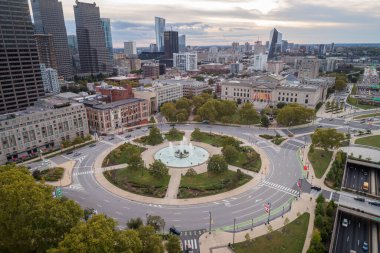Logan Square and Philadelphia Skyline, Downtown. Pennsylvania, USA. Traffic circle center features a large fountain with whimsical statuary, garden areas with benches.