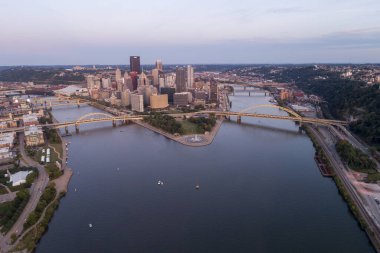 Cityscape of Pittsburgh in the evening. Allegheny and Monongahela rivers are in Background.