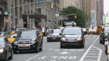 Daily Rush Hour Traffic in NYC, Manhattan. Truck, Cabs, Public Transport, Taxi in Background. Daytime