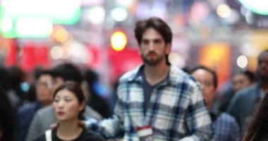 Anonymous Urban Crowd of commuters, unrecognizable tourists  walking in Manhattan, NYC. 5th Aveue. Blurry Background. 4k