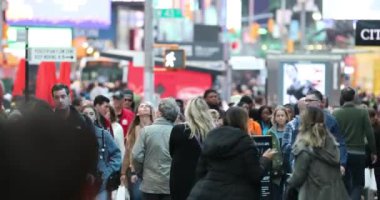 Anonymous Urban Crowd of commuters, unrecognizable tourists  walking in Manhattan, NYC. Times Square. Blurry Background. Traffic Lights. 4k