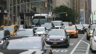 Daily Rush Hour Traffic in NYC, Manhattan. Truck, Cabs, Public Transport, Taxi in Background. Daytime