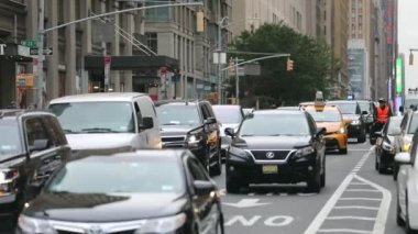 Daily Rush Hour Traffic in NYC, Manhattan. Truck, Cabs, Public Transport, Taxi in Background. Daytime