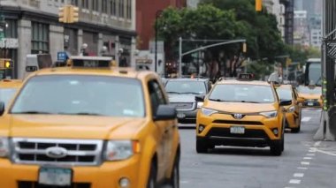 Traffic in NYC, Manhattan and People Crossing Street. Traffic, Cabs and Public Transport Background. Daytime