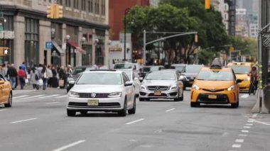 Traffic in NYC, Manhattan and People Crossing Street. Traffic, Cabs and Public Transport Background. Daytime