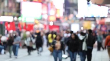 Anonymous Urban Crowd of commuters, unrecognizable tourists walking in Manhattan, NYC. 7th Avenue. Blurry Background. Daytime