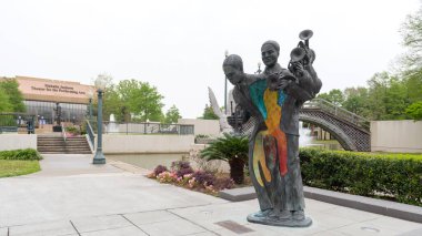 Louis Armstrong Park Statue and Bridge with Mahalia Jackson Theater for the Performing Arts in background