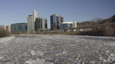 Ice Drift In Vilnius, Capital of Lithuania. River Neris. Ice floes float on the river in the spring. Ice drift movement. Winter landscape. Melting ice water, global warming climate change concept.
