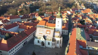 Main square in upper town in historic old city center in Zagreb, Croatia. Roof of Saint Mark church in background, Zagreb.