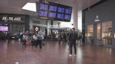 International Copenhagen Airport. Departure Are with Screens and People.