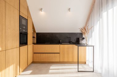 Bright Modern Kitchen in New Luxury Home, Hardwood Floors, Dark Wood Cabinets.